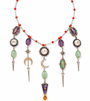 Amdavad Necklace silver collar strung with coral red beads, featuring a crescent moon, large pearl, violet enamel dagger, star motifs, and sword drop pendants, from the Shashikala collection by UBAA