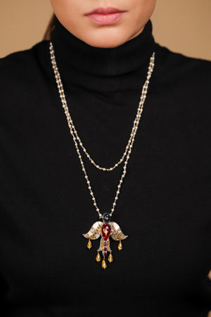Deval Necklace worn with structured tailoring, the Garuda pendant as the centrepiece