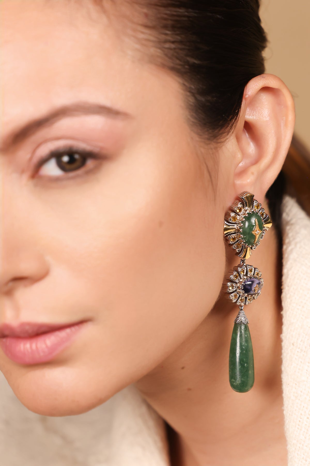 Close-up of the diamond sunburst and kyanite oval detailing on the Diya Earrings