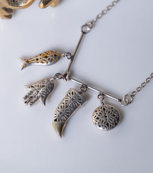 Kai Necklace layered with other UBAA pieces for a personalized look