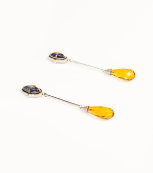 Detail of the faceted topaz briolette drop and black enamel detailing on the Meeti Earrings