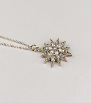 Nova Necklace with a starburst-inspired silhouette handcrafted in sterling silver, adorned with luminous Japanese pearls