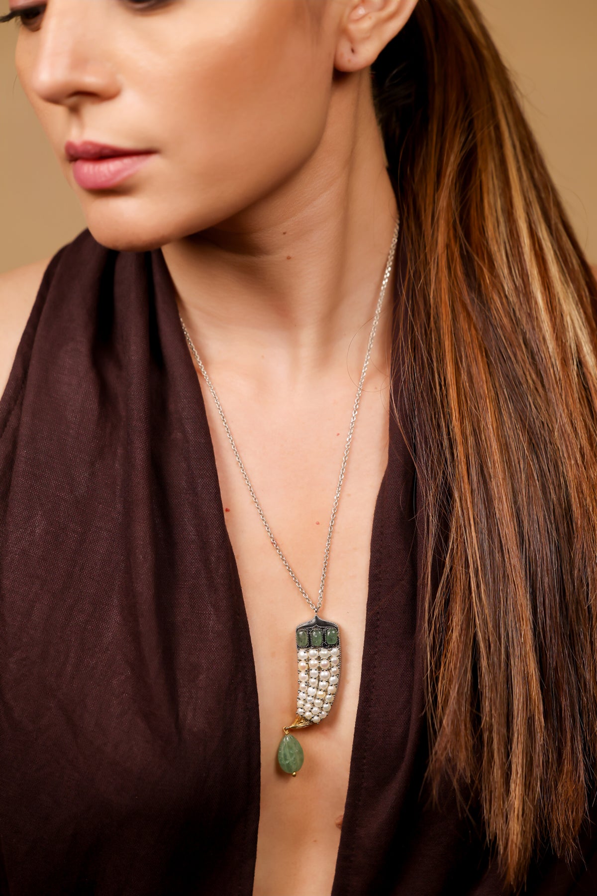 Close-up of the Sage Pendant showing the natural green aventurine and Japanese pearl detailing