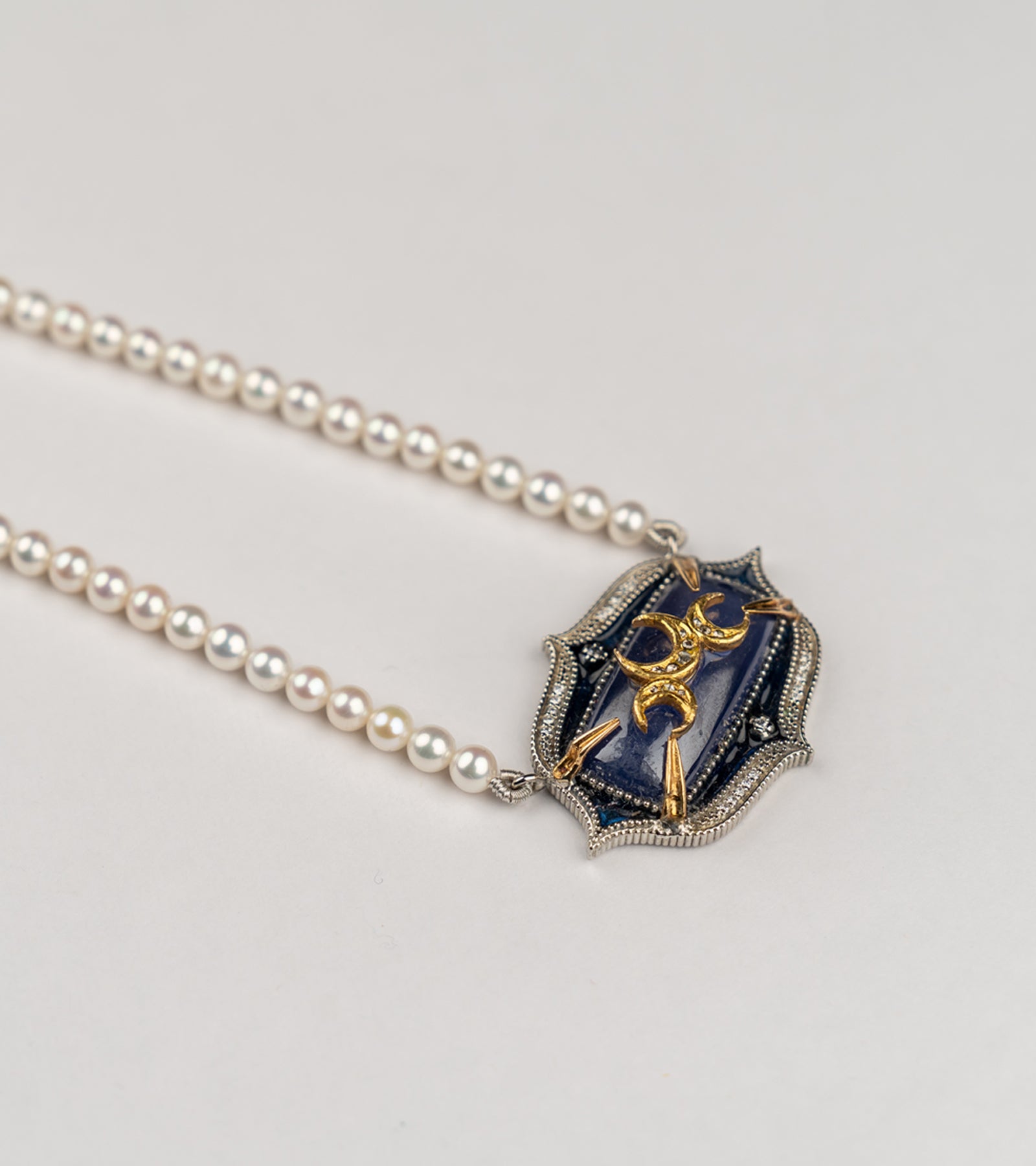 Samarkand Necklace in silver with 22K and 18K gold, kyanite, natural diamonds, and hand-painted blue enamel, strung with crafted pearls