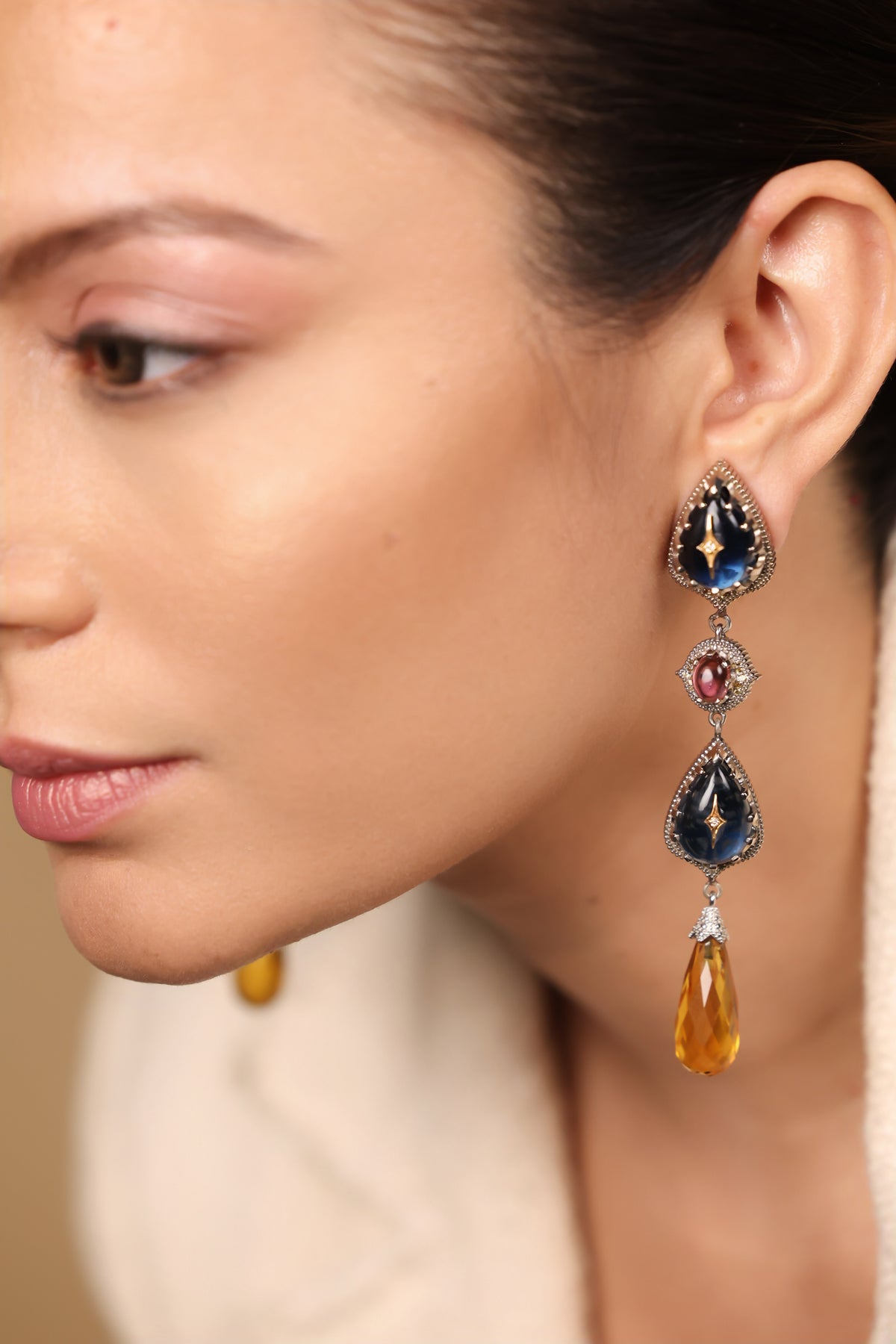 Close-up of the three-tier layered drops on the Sara Earrings showing the kyanite and citrine stones