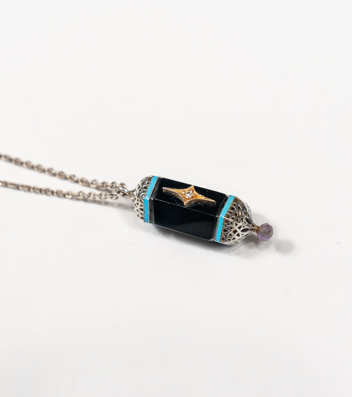 Sirius Pendant with black onyx, natural diamonds, framed in silver with 18K gold accents and hand-painted turquoise enamel
