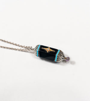 Sirius Pendant with black onyx, natural diamonds, framed in silver with 18K gold accents and hand-painted turquoise enamel