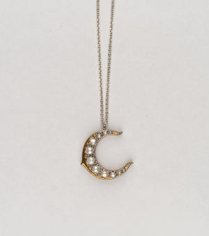 Detail of the Japanese pearls set along the Tsuki Necklace's silver crescent