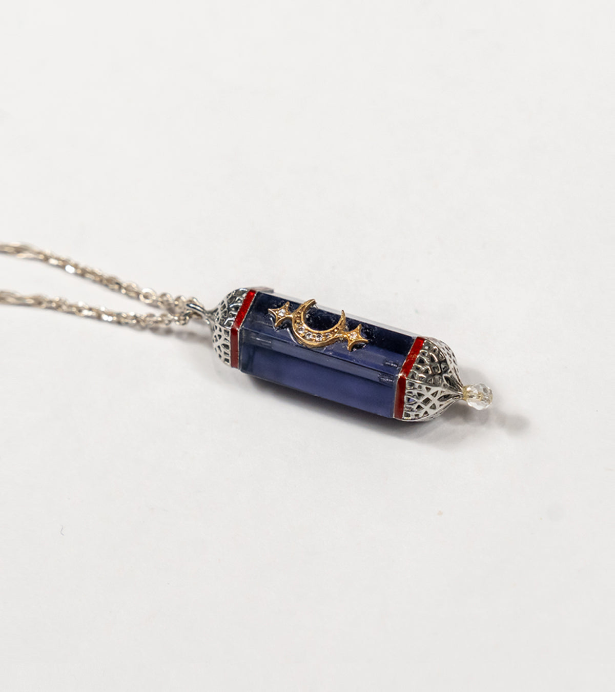 Vega Pendant with a 36.5 ct amethyst centerpiece, framed in silver with 18K gold accents and hand-painted enamel