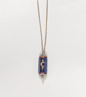Detail of the hand-painted coral enamel accent on the Vega Pendant
