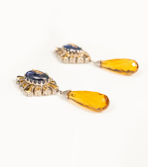 Detail shot of the Virja Earrings showing the crafted kyanite and topaz stones set in 18K gold and sterling silver
