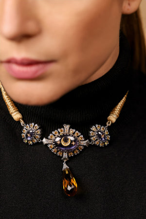 Virja Necklace worn with neutrals, letting the blue detailing take centre stage