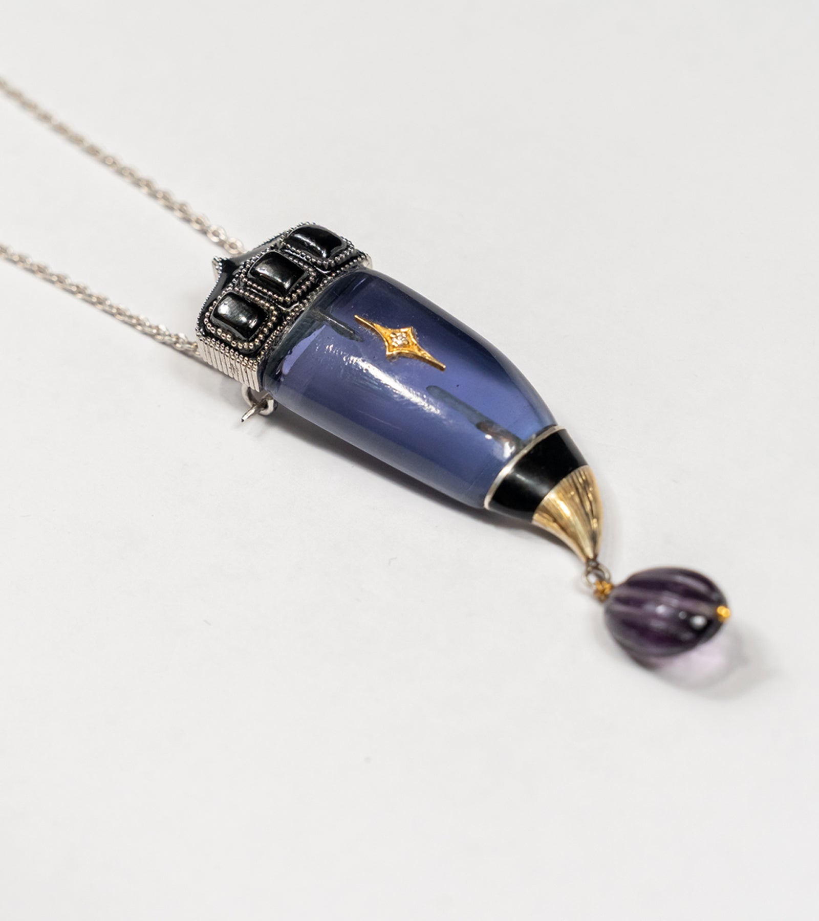 Vita Brooch Pendant in purple amethyst crystal, crafted in sterling silver with 18K gold accents, natural diamonds, and hand-painted blue enamel