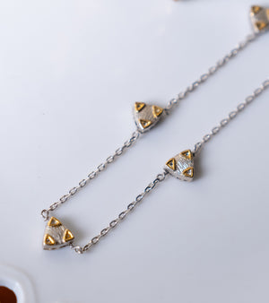 Close-up of the trillion Polki charms and silver chain detailing on the Zee Necklace