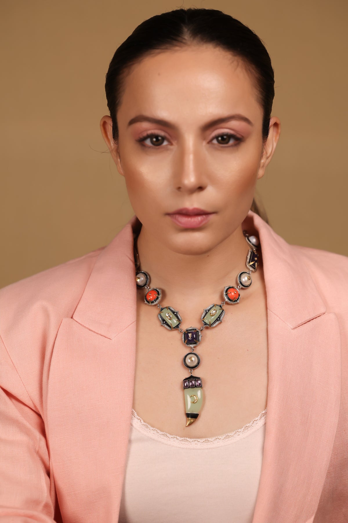 Close-up of the amethyst crystal and aqua onyx detailing on the Zuri Necklace