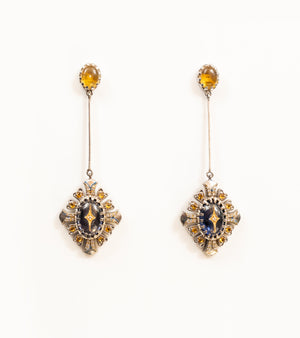 Ada Earrings with a crafted topaz stud, long silver bar, and diamond-shaped pendant in blue kyanite, topaz, and diamonds, with blue hand-painted enamel