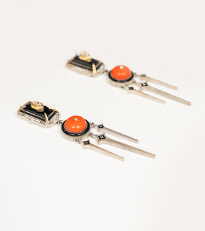 Detail of the crafted coral and gold accents on the Adel Earrings