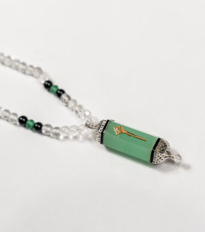 Altair Pendant with 38 carats of aqua onyx, framed in silver with 18K gold highlights and hand-painted black enamel
