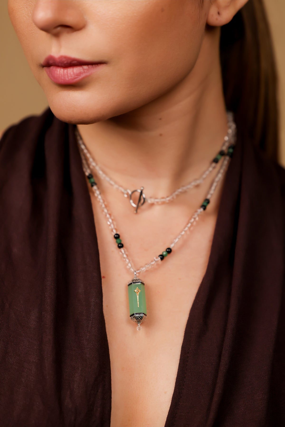 Altair Pendant worn solo over a monochrome look, letting the aqua onyx stand out