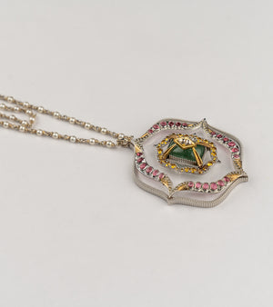 Amara Necklace with a long double strand of crafted pearls in silver wire, leading to an architectural pendant with crafted stones and a gold star motif