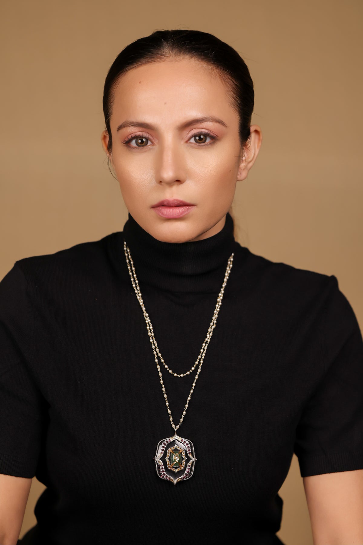 Amara Necklace worn with simple, structured clothing, letting the pendant stand as the focal point