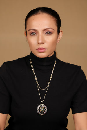 Amara Necklace worn with simple, structured clothing, letting the pendant stand as the focal point