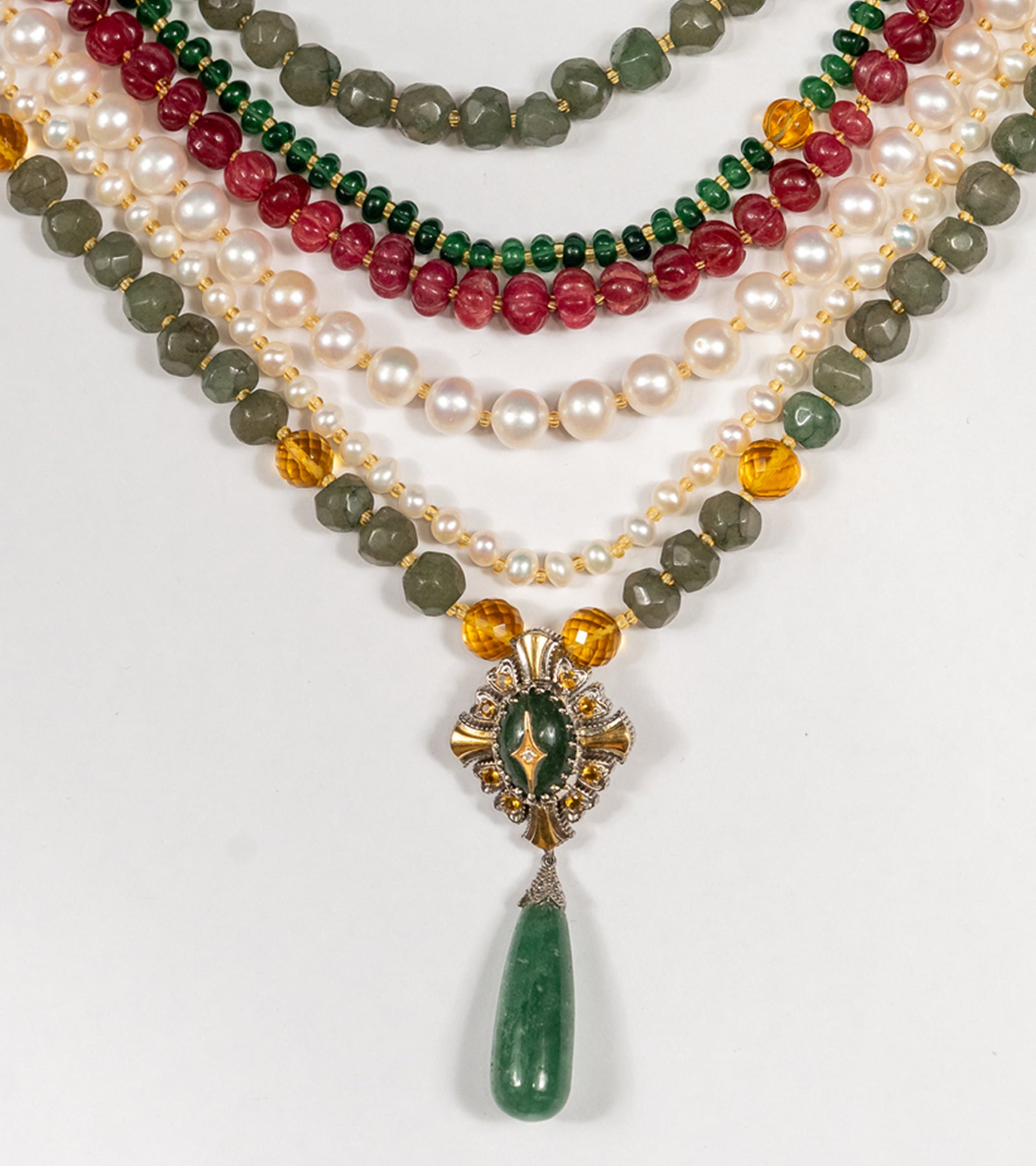 Detail of the gold and aventurine pendant on the Anuradha Necklace