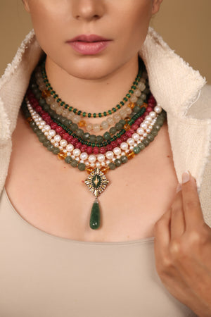 Close-up of the layered strands on the Anuradha Necklace showing aventurine, quartz, onyx, and pearl beads