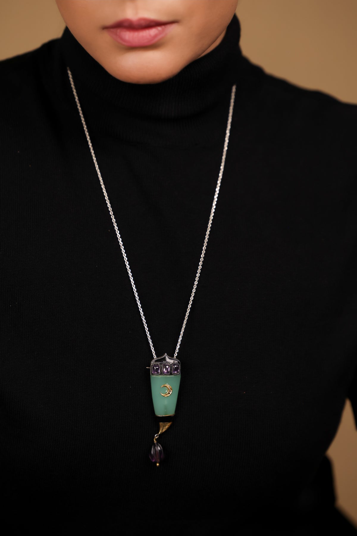 Close-up of the green onyx and amethyst crystal detailing on the Clio Brooch