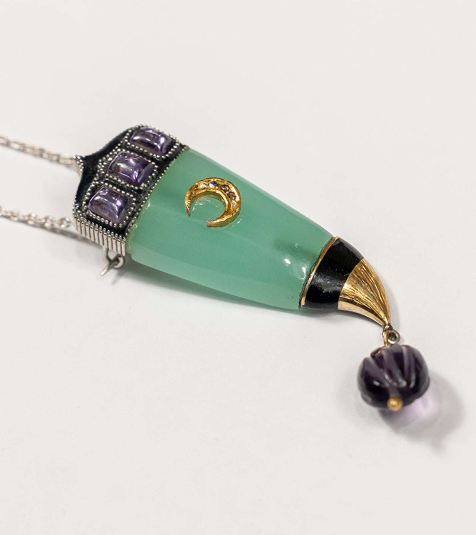 front.jpg	Clio Brooch crafted in 22K and 18K gold with natural Polki diamonds, green onyx, and amethyst crystal, hand-painted black enamel