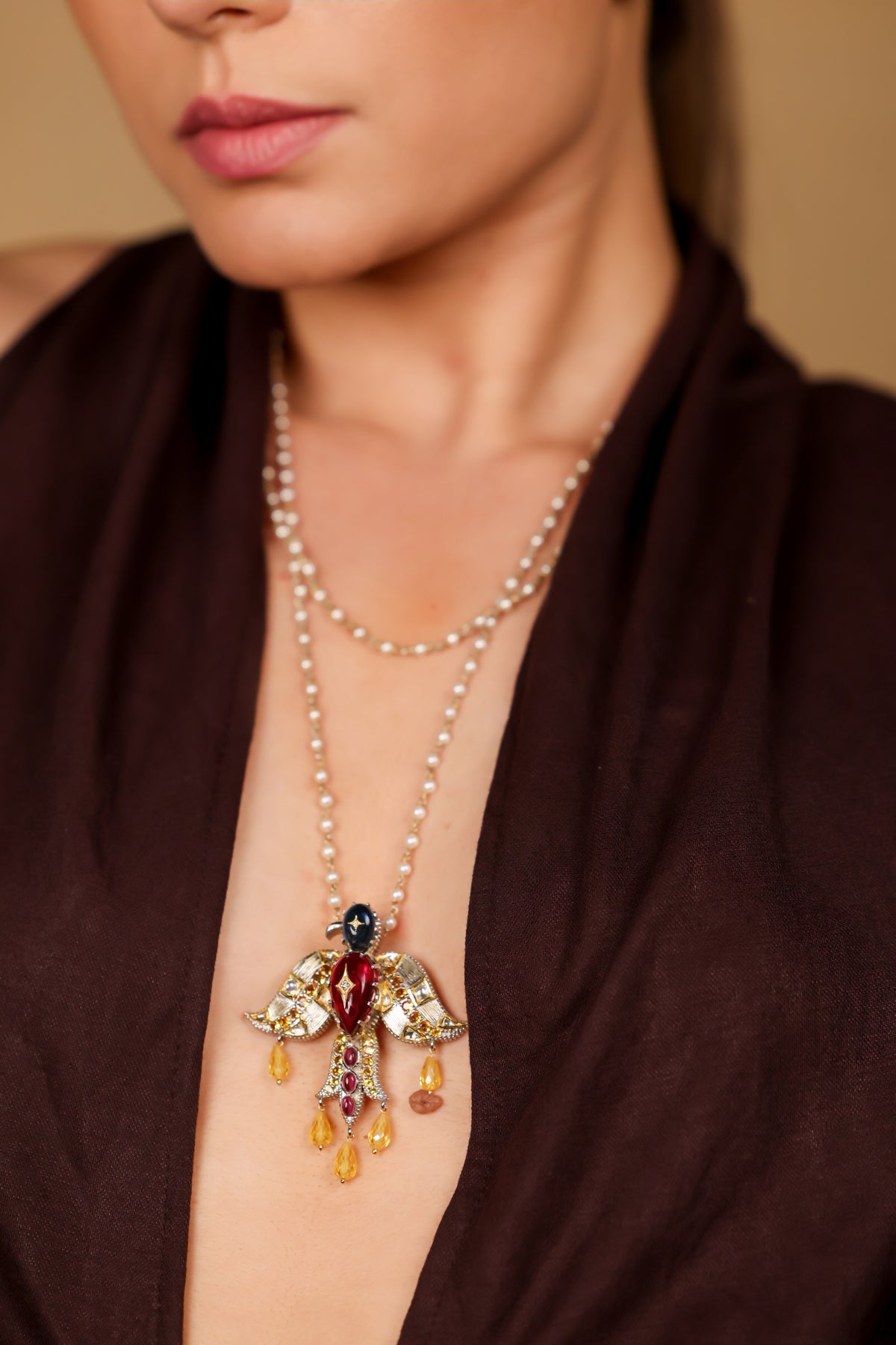 Close-up of the Garuda pendant on the Deval Necklace showing the kyanite and citrine detailing