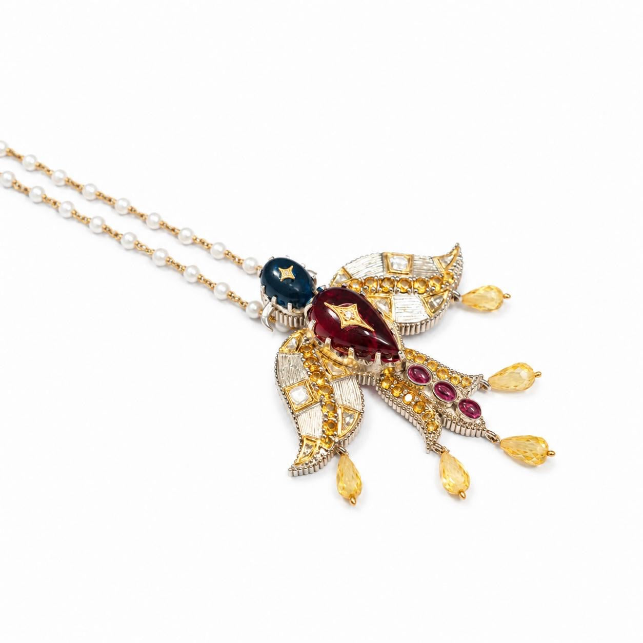 Deval Necklace featuring a Garuda pendant crafted in kyanite, citrine, and tourmaline, with 22K Kundan gold and 18K gold accents