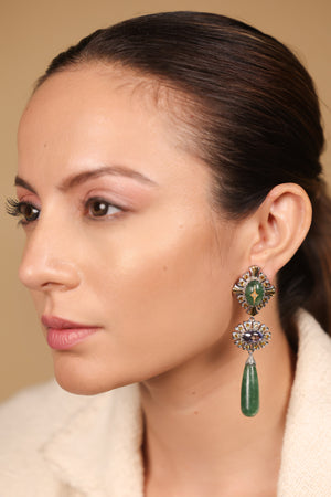 Diya Earrings worn as a statement pair, paired with a simple neckline