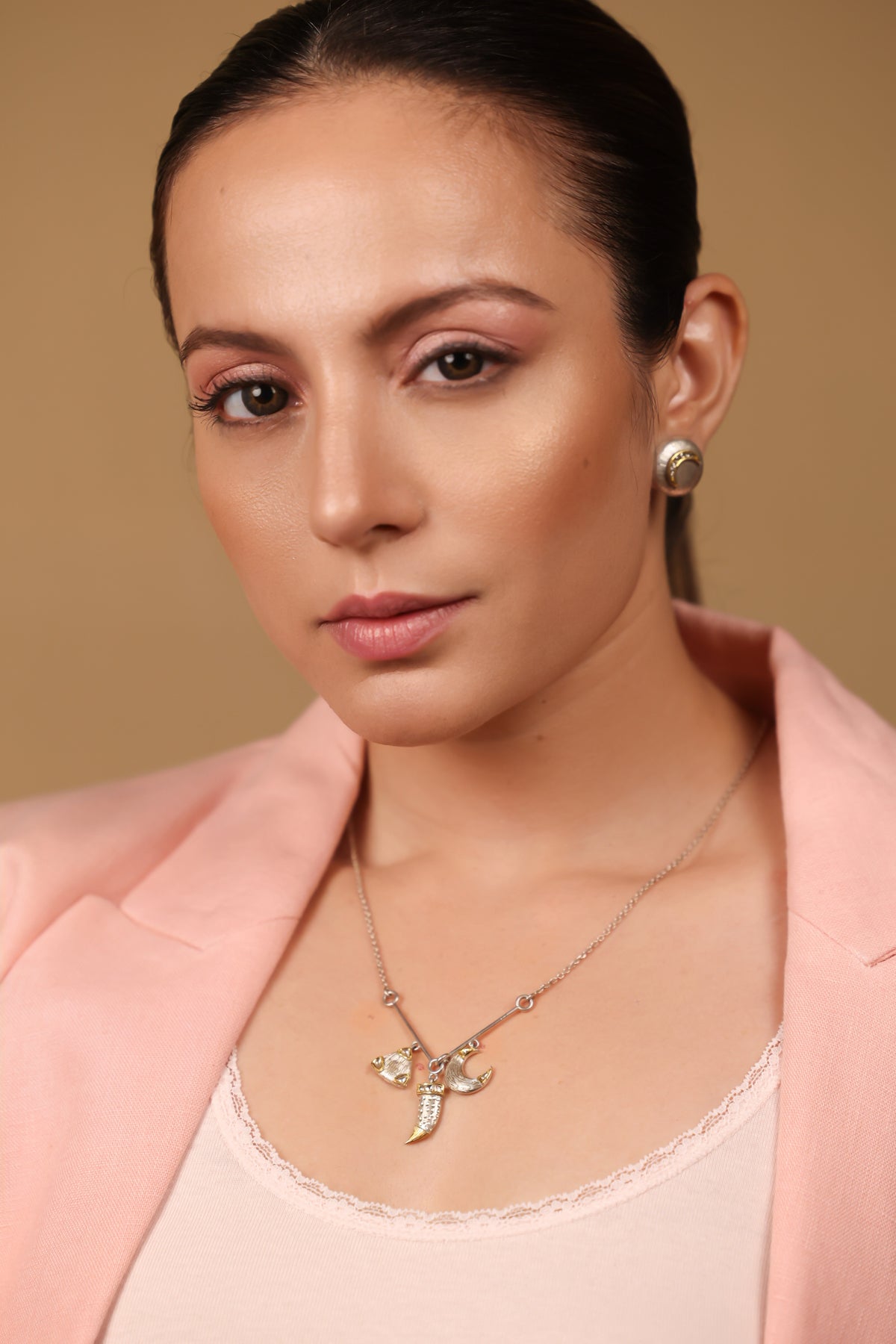 Eva Necklace layered with other pieces for a day-to-night styled look