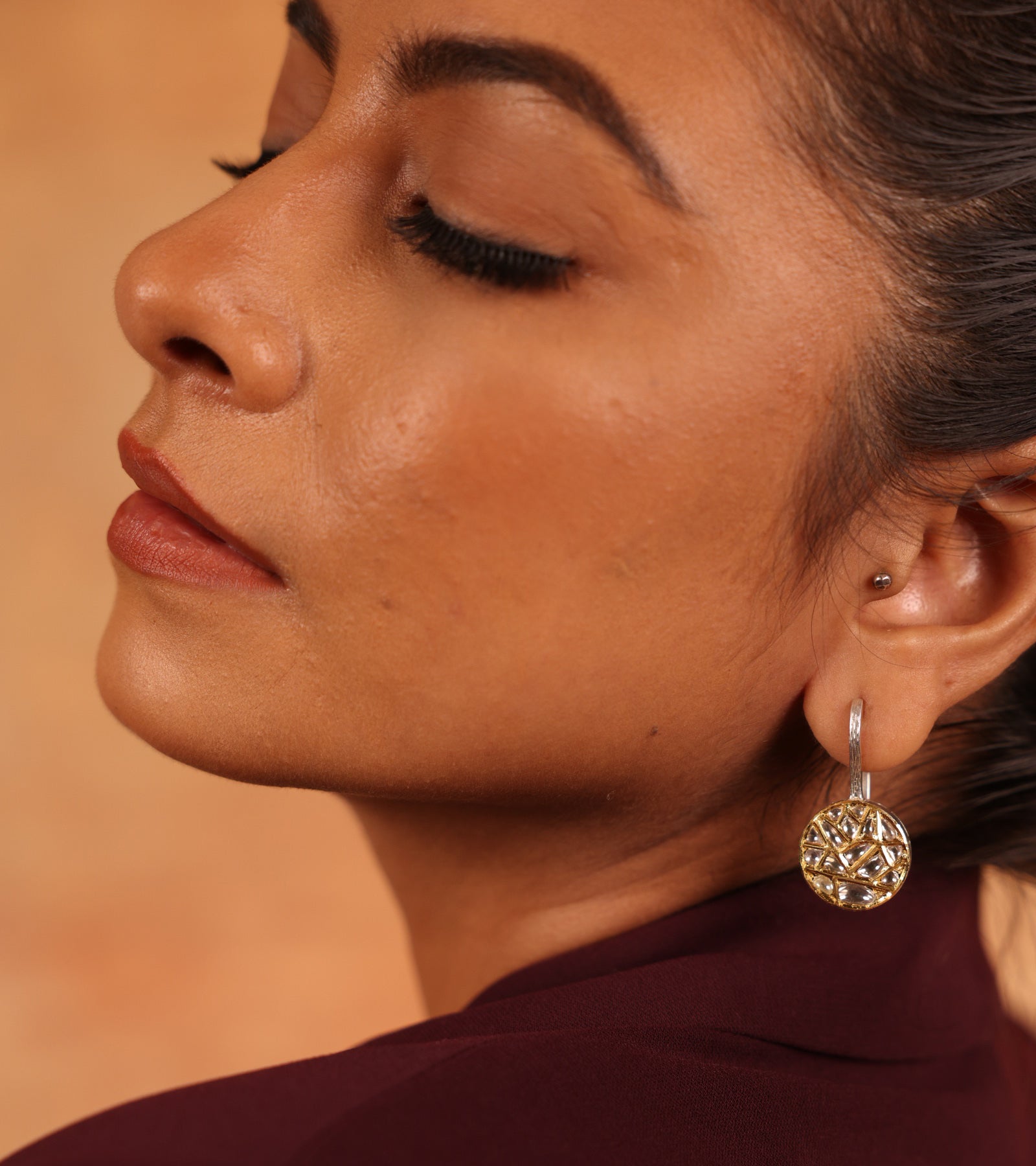 Close-up of hand-set Polki diamonds in Kundan gold on the Goya Balis