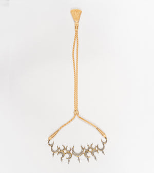 Side profile of the Icra Choker showing its structured silhouette and enamel-detailed silver work
