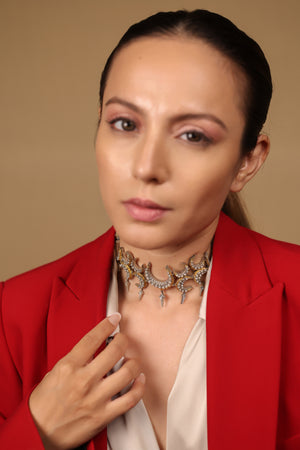 Icra Choker worn with a deep neckline, standing as the defining element of the look
