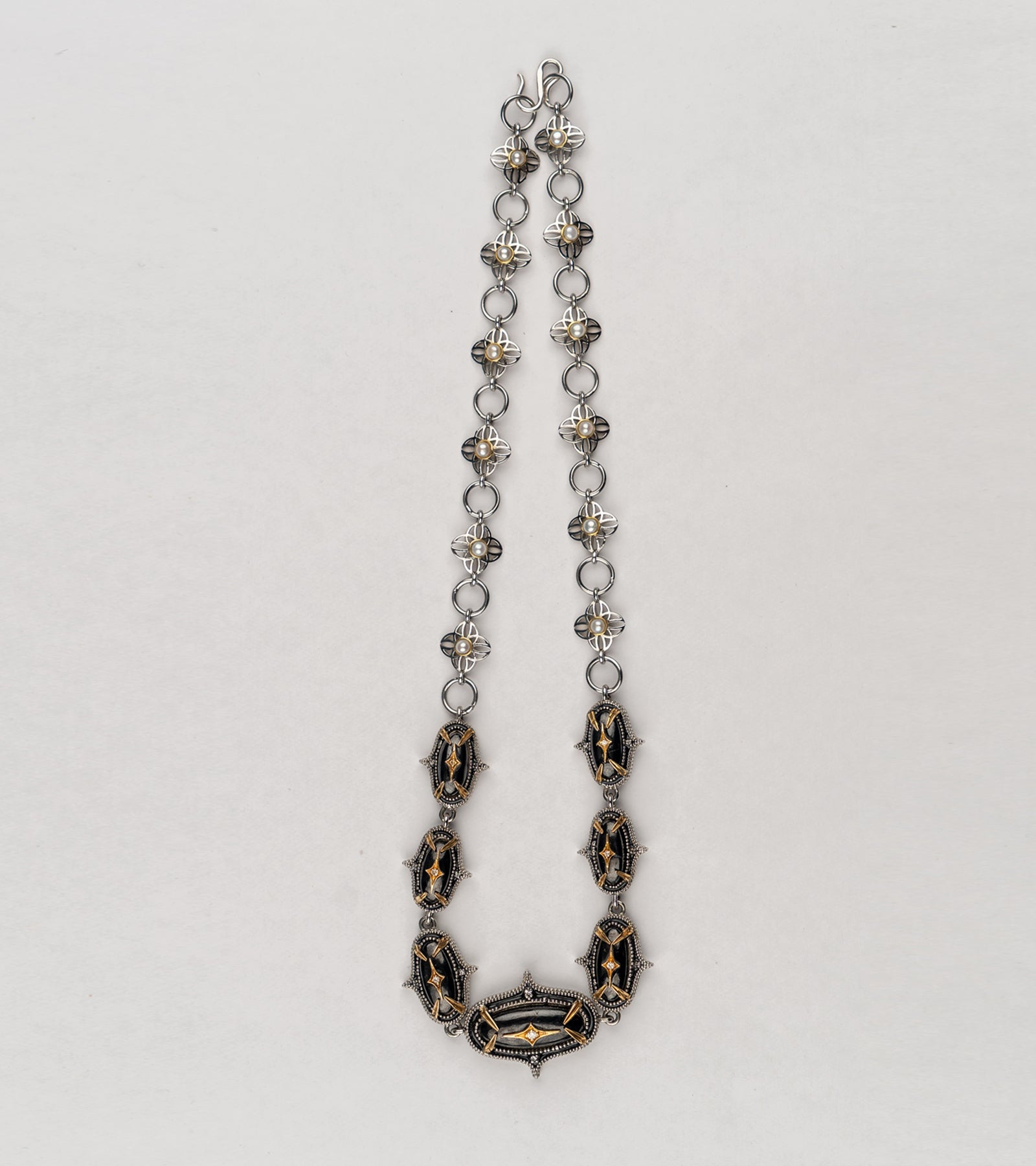 Detail of the hand-painted black enamel and clean silver lines on the Jaipur Necklace