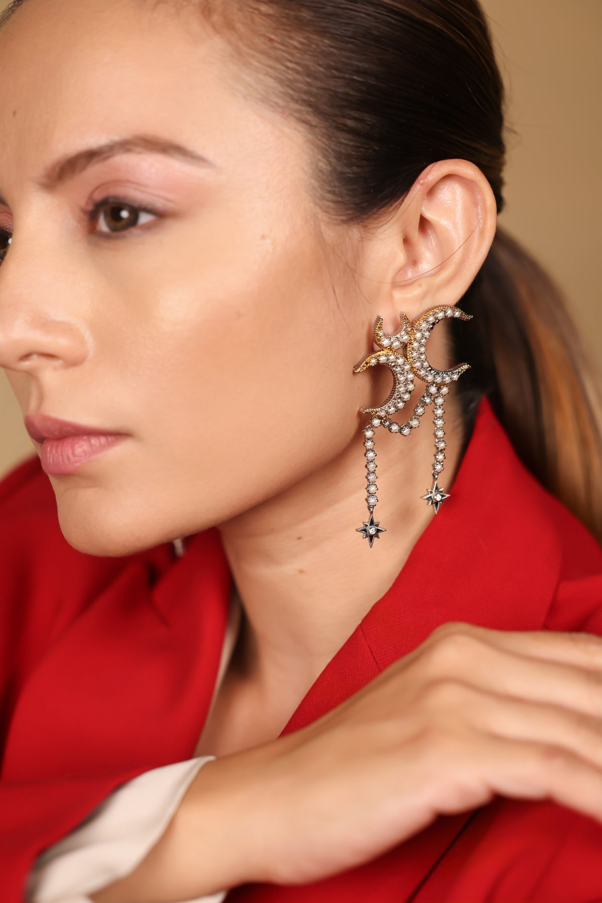 Kashvi Earrings worn with sleek hair, showing the crescent and star drape in movement