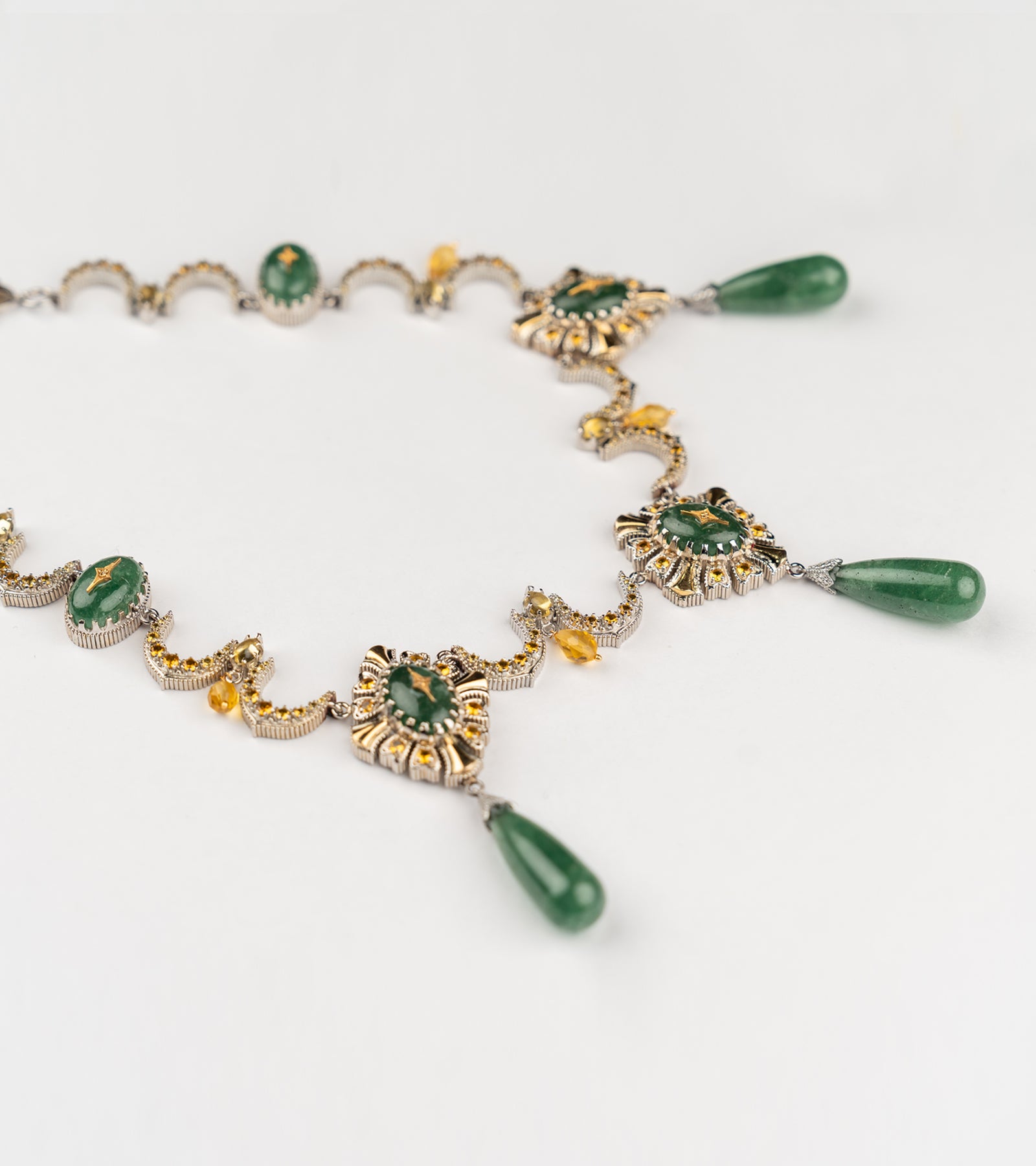 Neelima Necklace with scalloped gold and diamond work, anchored by a central aventurine stone with aventurine drops and crafted yellow citrine