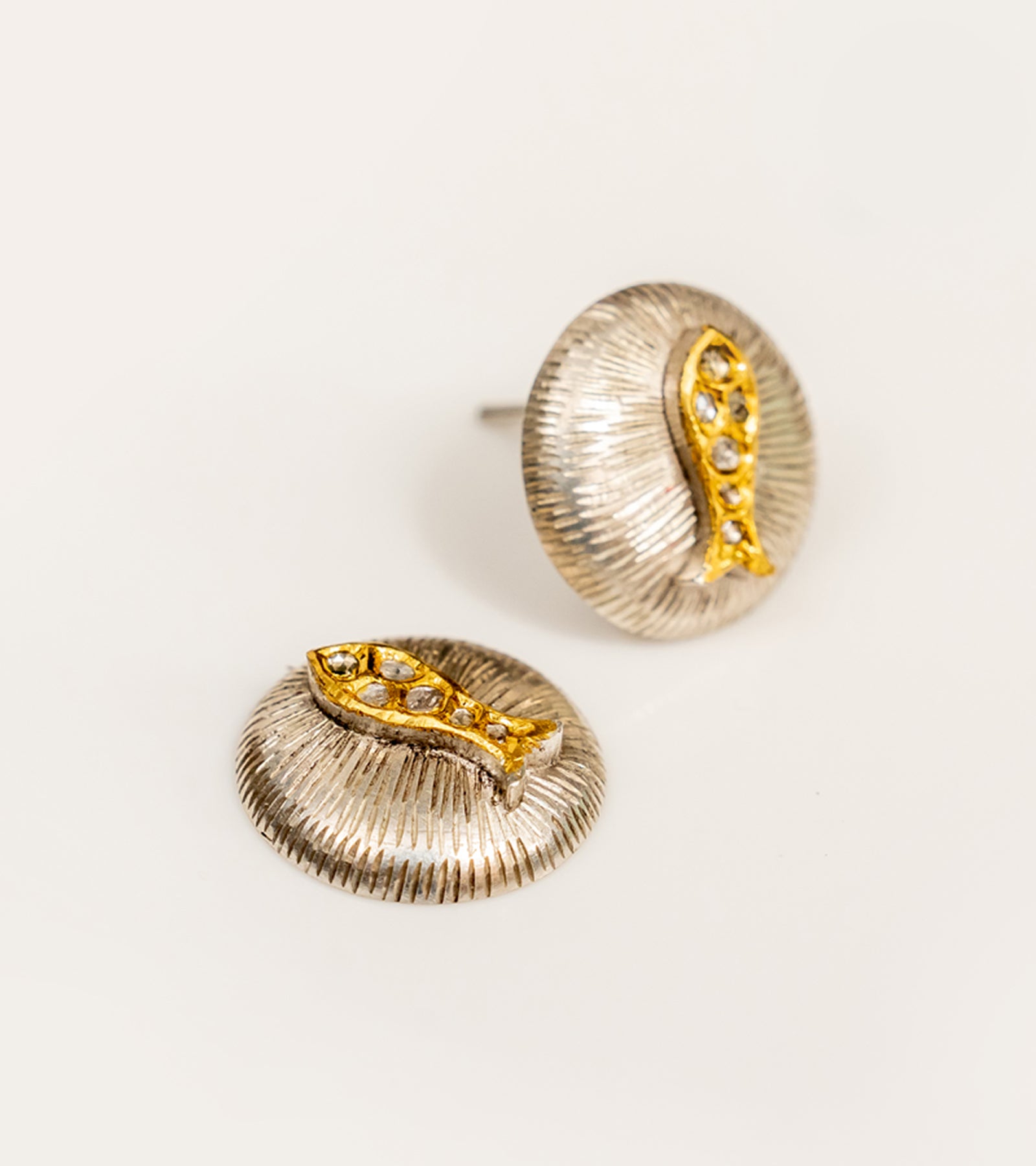 Detail of the fine gold accents on the Nox Earrings' silver setting