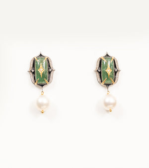 Close-up of the green stone and diamond detailing on the Rewa Earrings' green colorway