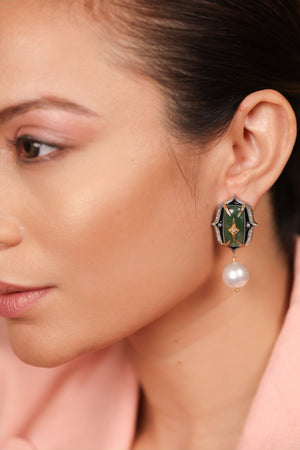 Rewa Earrings in a green stone colorway, silver with 18K gold accents, FG VS diamonds, black enamel, and South Sea pearl drops