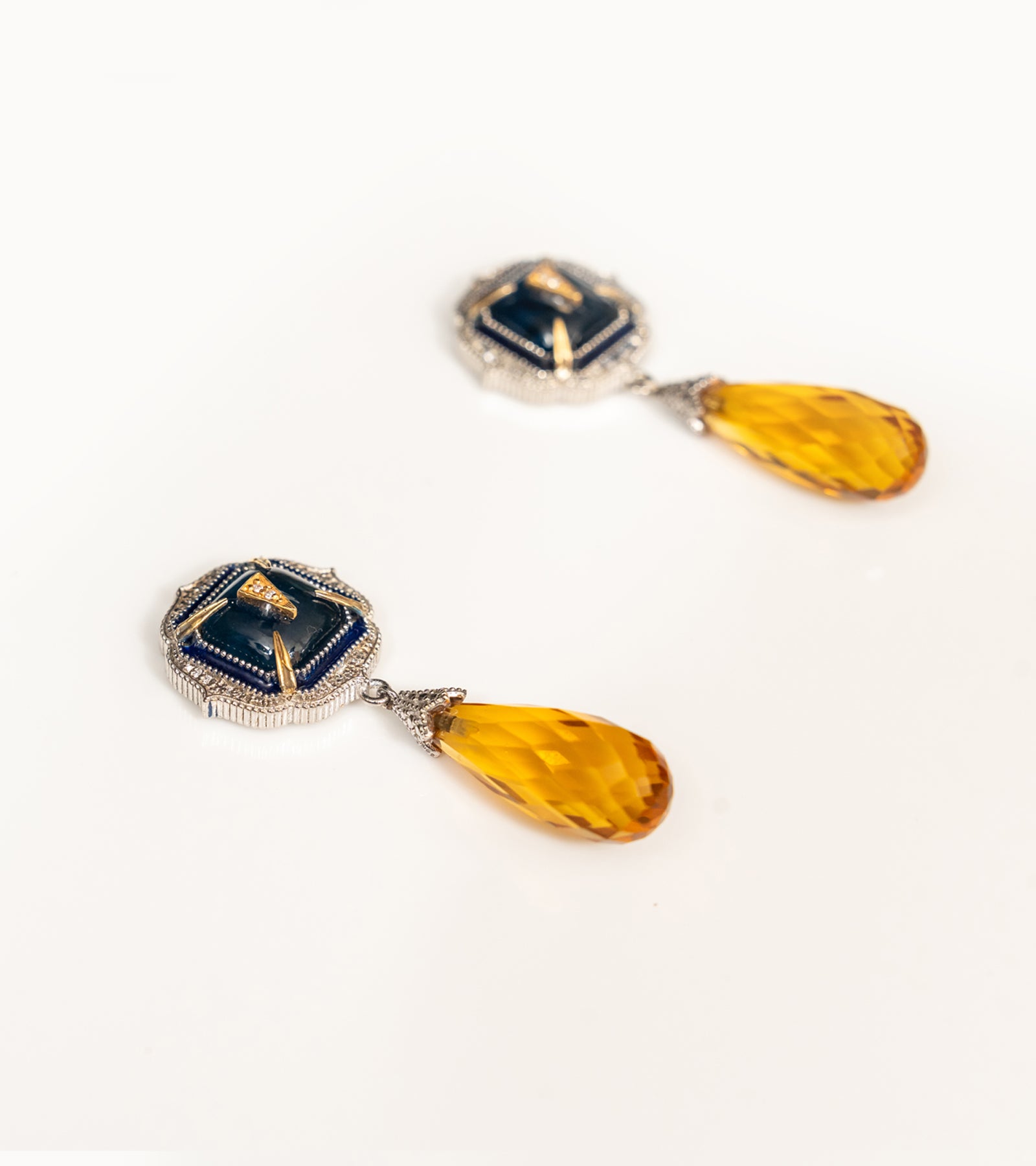 Detail of the faceted topaz drop finishing the Rumi Petit Earrings
