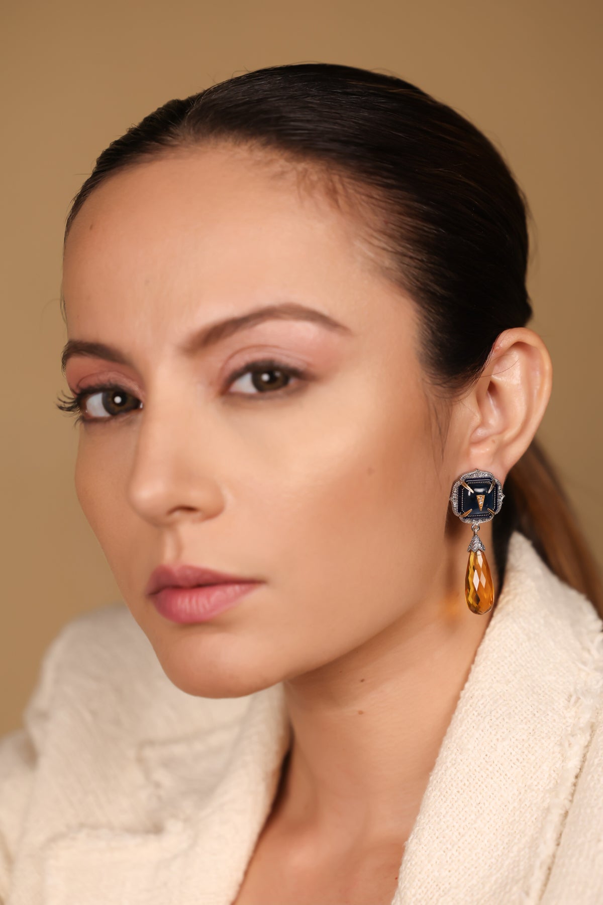 Rumi Petit Earrings worn with a clean neckline for an effortlessly sophisticated look