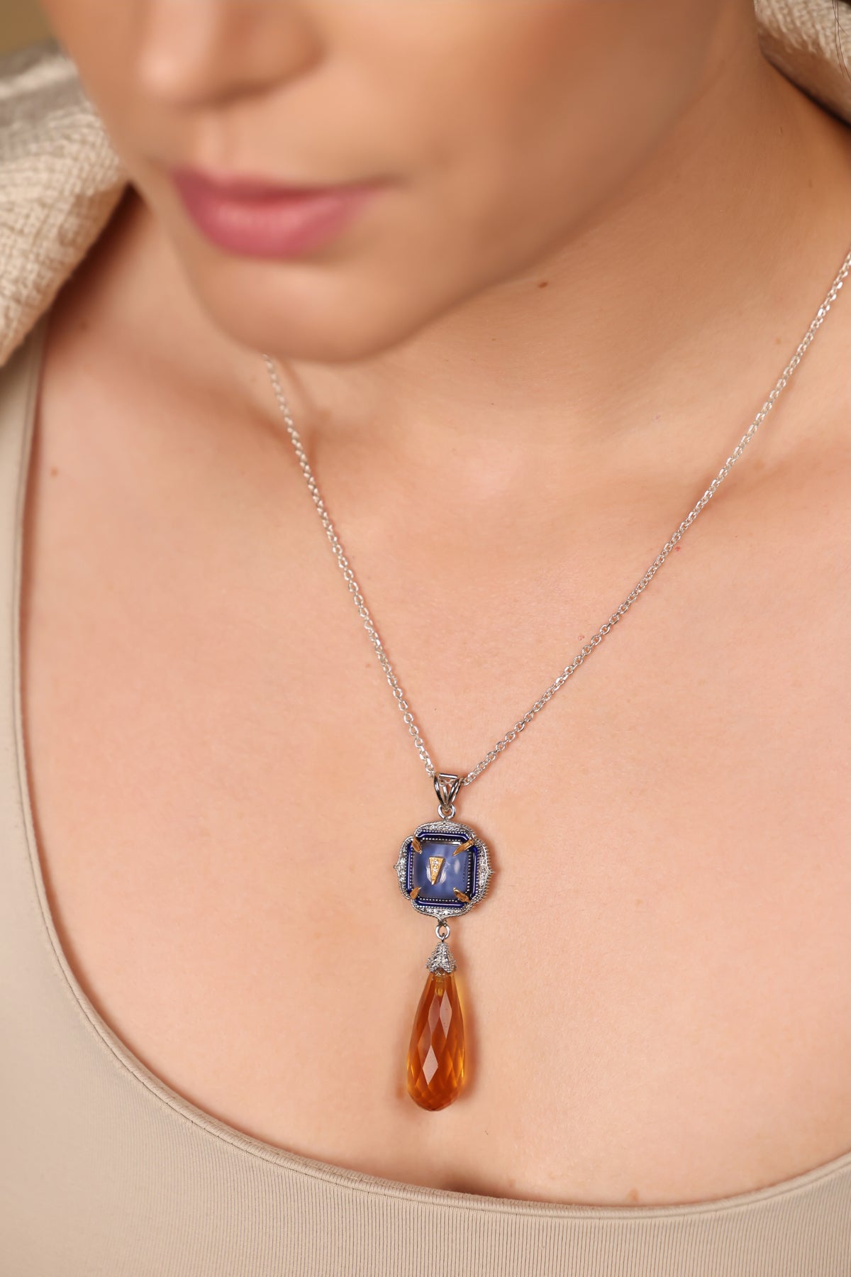 Rumi Petit Pendant worn layered with delicate silver chains