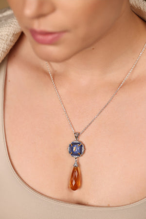 Rumi Petit Pendant worn layered with delicate silver chains