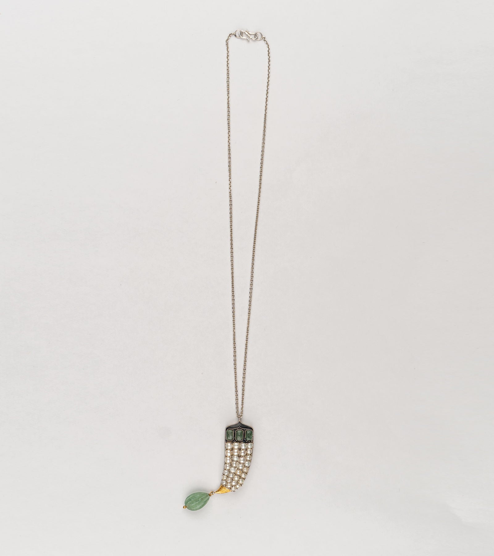 Detail of the sculptural cornucopia form on the Sage Pendant in sterling silver