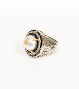 Shakuntala Ring with a South Sea button pearl framed by natural diamonds, sterling silver, and 18K gold