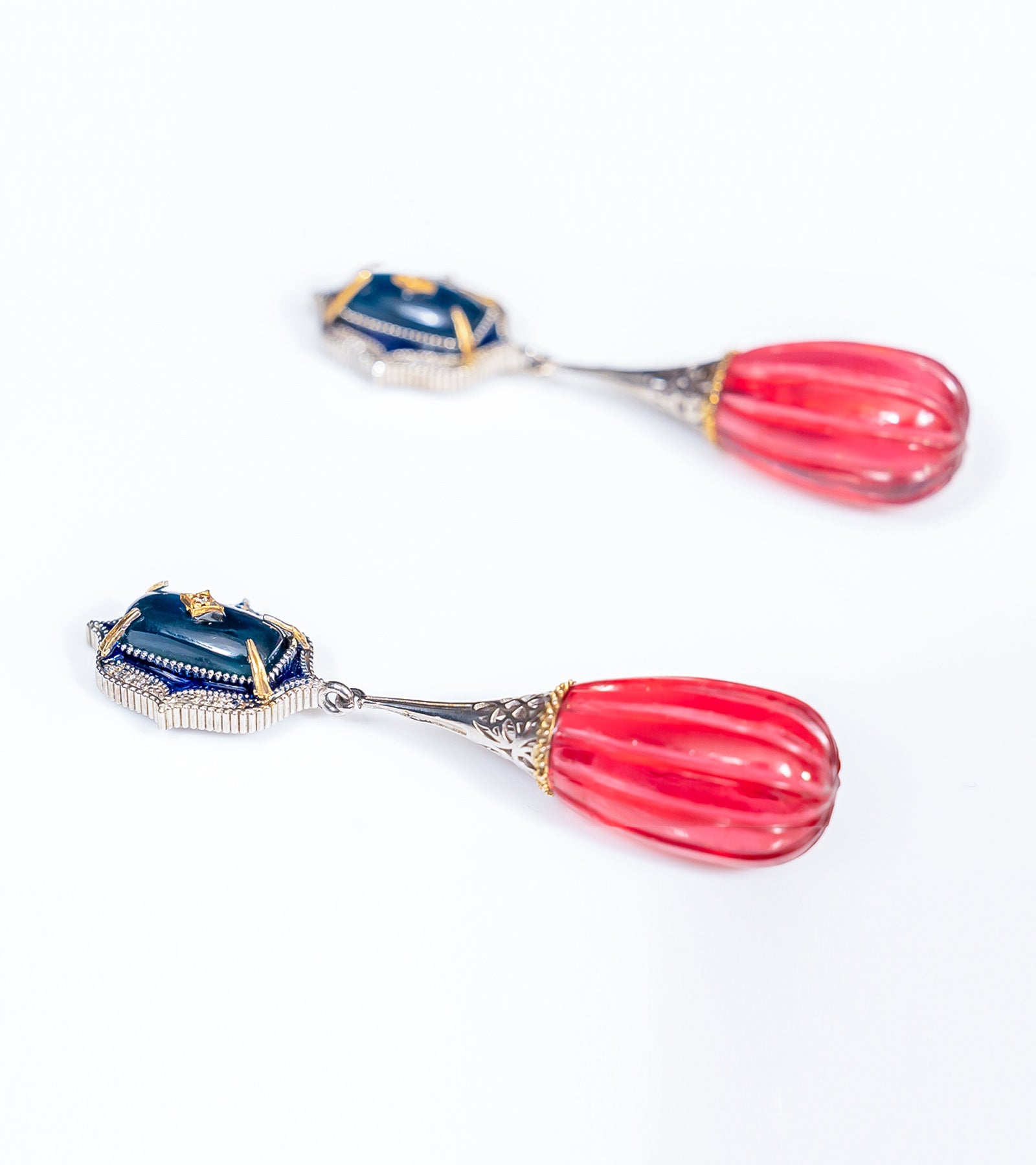 Detail of the blue hand-painted enamel on the Sur Earrings